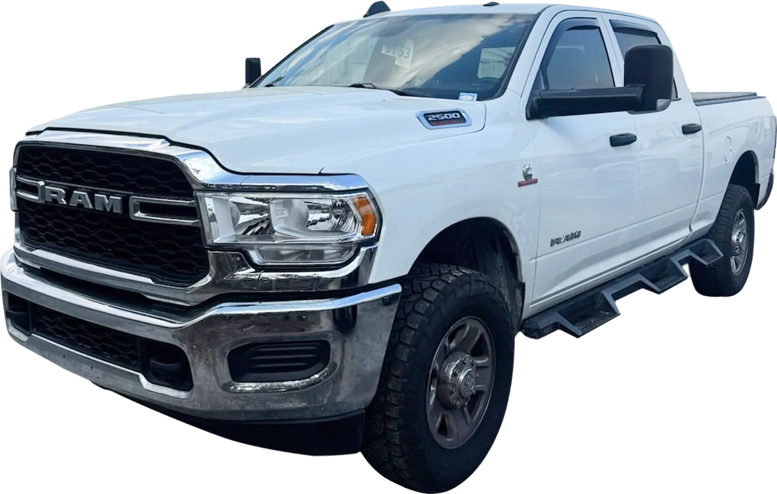 A white 2024 RAM 2500 Tradesman pickup truck is shown at a slight angle